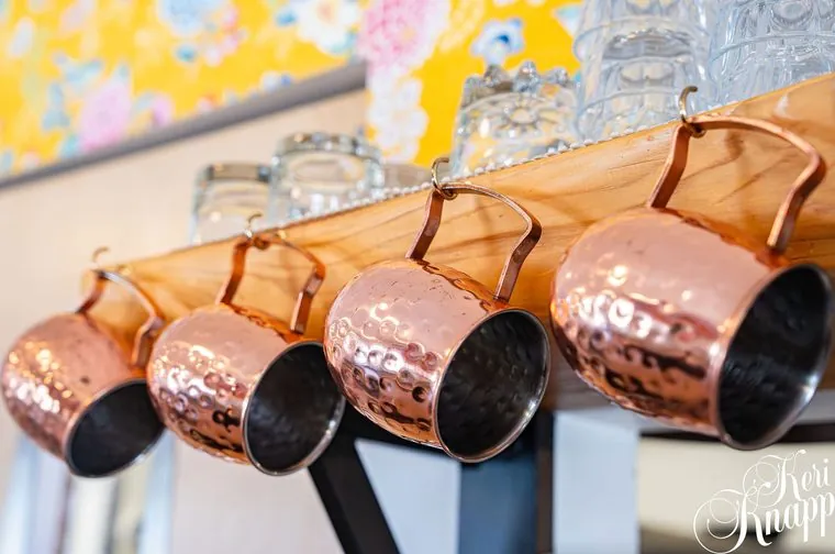 Copper mugs on the wall